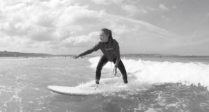 How to stand up on a surfboard