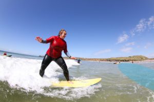 How to turn a surfboard on whitewater waves